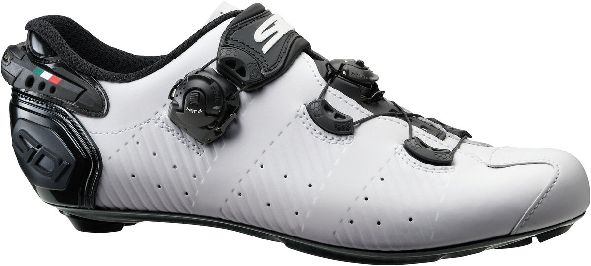 White cycling shoe with black accents on a white background