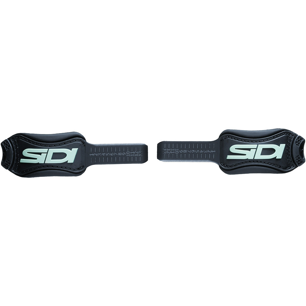Two black ankle straps with SIDI branding on a white background
